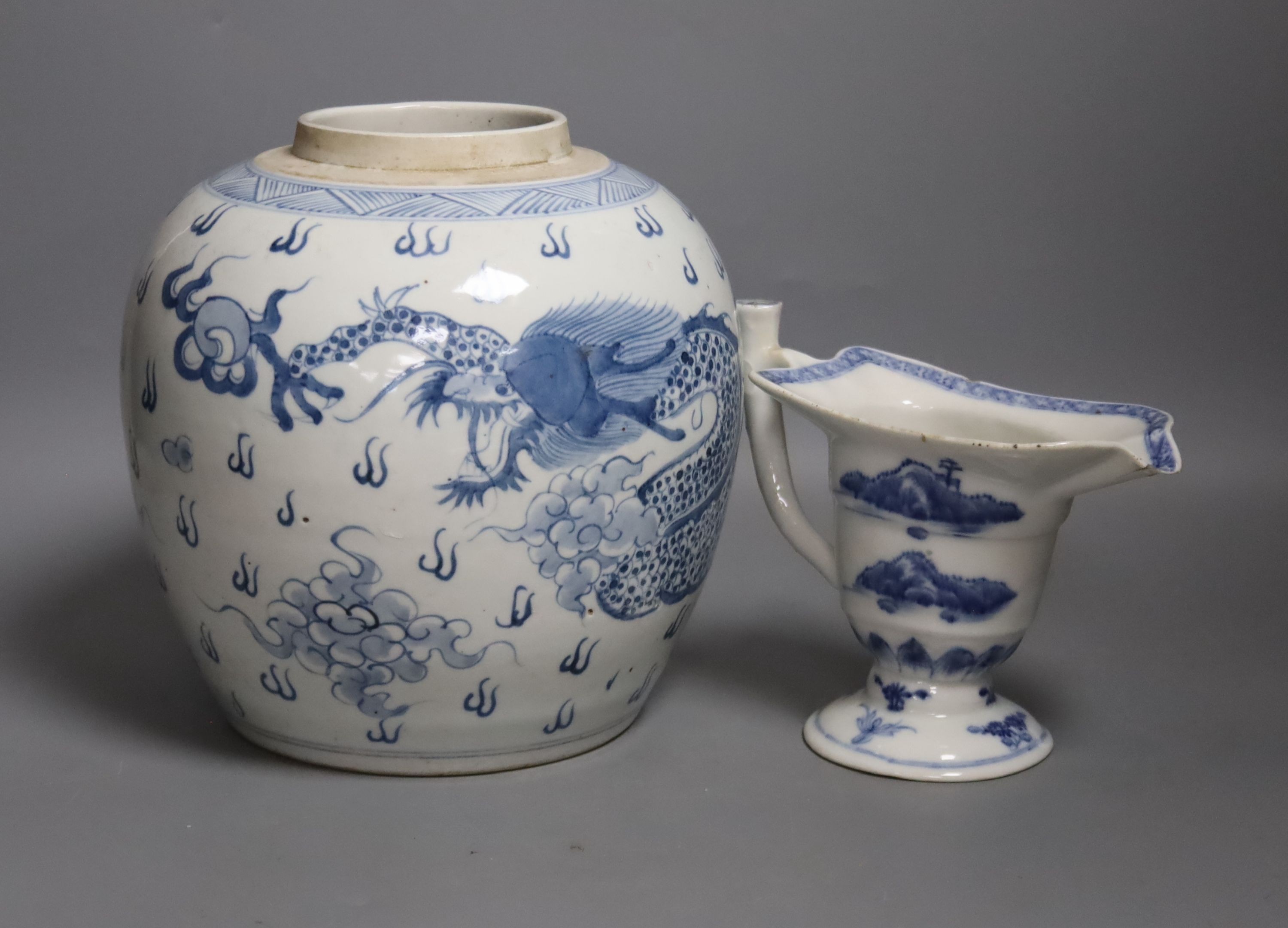 A Chinese blue and white jar, 20cm and a helmet shaped jug, 18th century and later
